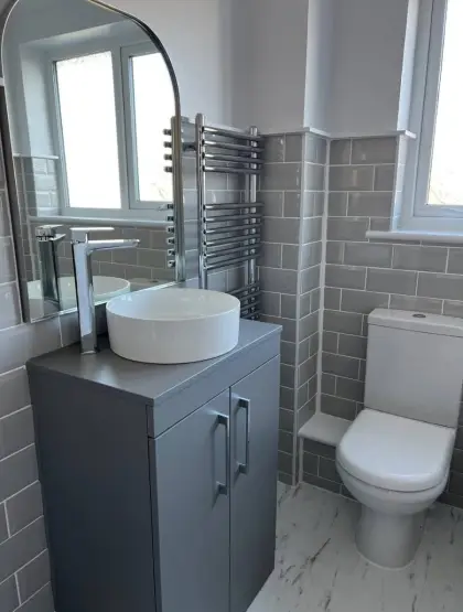 Vessel basin on a grey vanity unit