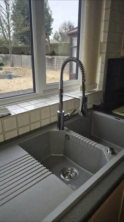 Black composite sink with pull-out spray tap