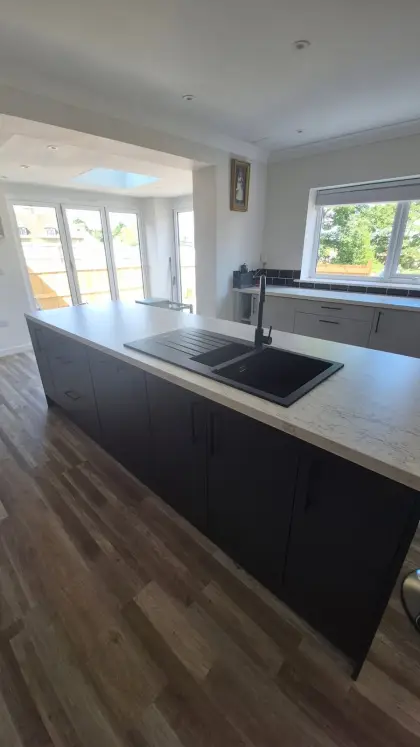 Kitchen island with inset black sink